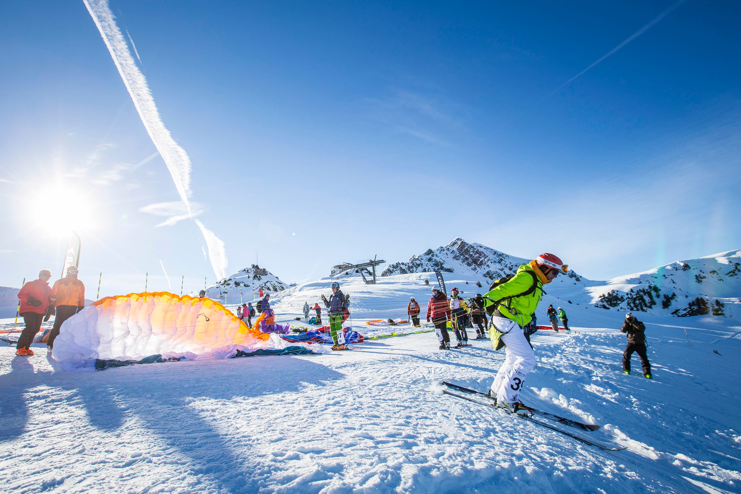 Paraglider landed on the snow at the foot of the Courchevel slopes